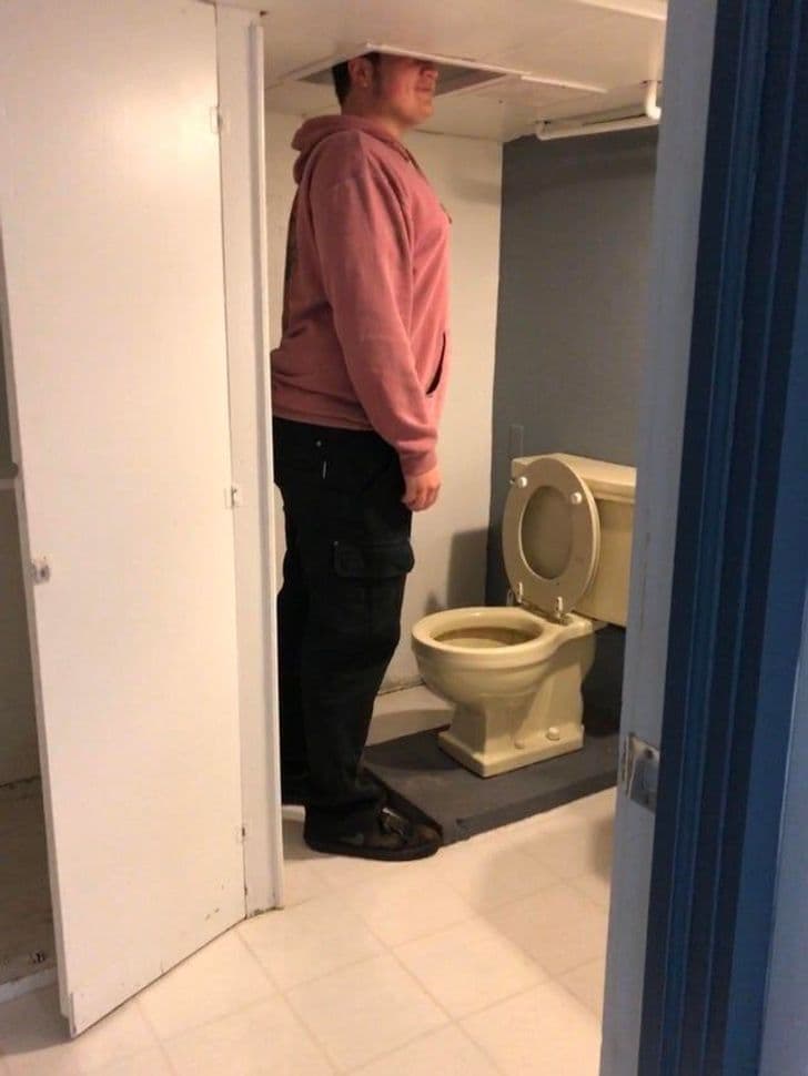 “This is the bathroom in my dad’s new house. I’m 6’1” and the room is so low, they had to cut holes in the ceiling over the toilet and sink so you can stand up there."