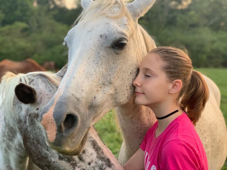 “My stepdaughter and her new horse named Ghost”